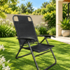 Sillón negro moderno en jardín soleado - Cortinería Confort Rosario